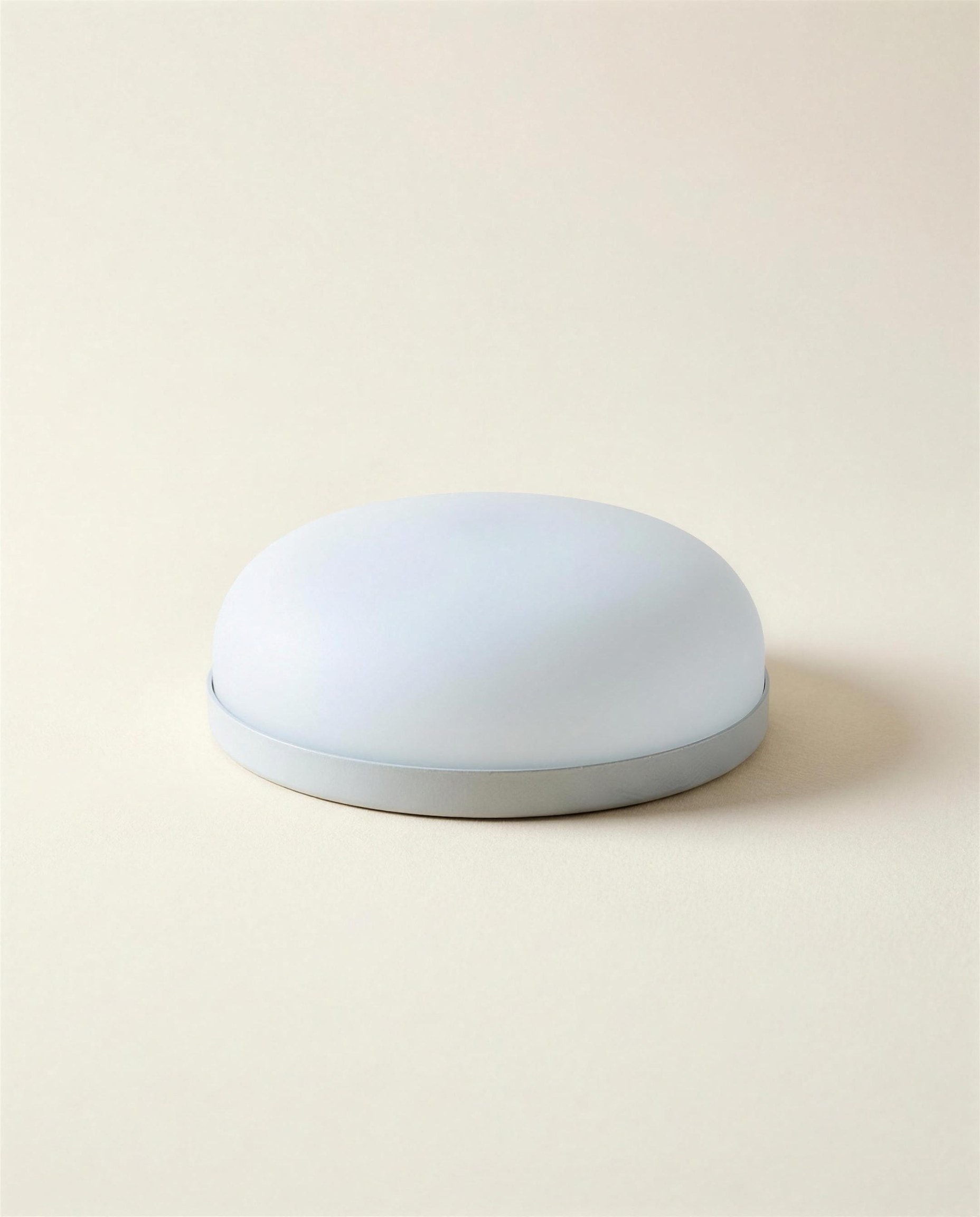 The Hollis Ceiling Dome: a shallow opal glass dome on a slim pale grey mounting rim.
